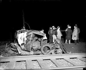Auto hit by train kills two. Belmont