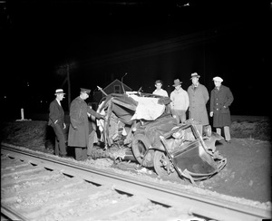 Auto hit by train kills two. Belmont