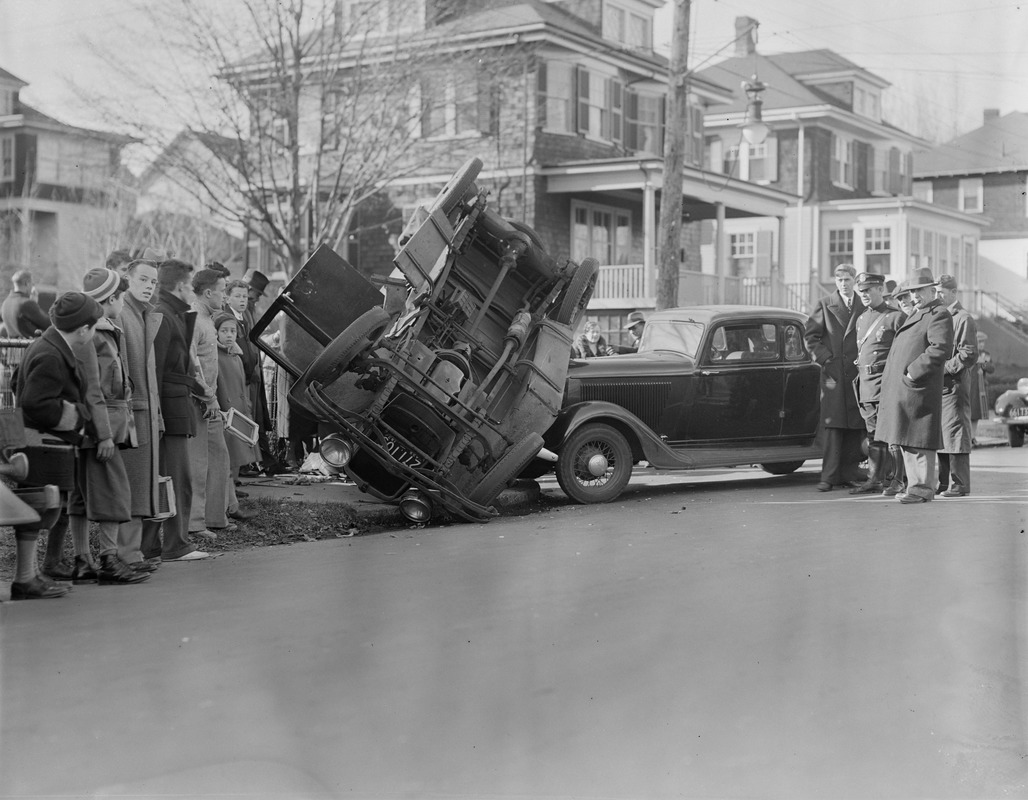 Auto on sidewalk of residential street