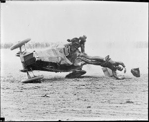 Southport, England. A remarkable photo, taken at the actual moment of the overturning of a racing car of Miss Mary Cunliffe, English driver, during a 100-mile race on the Southport Sands. Showing her father, who was riding with her being hurled to death.