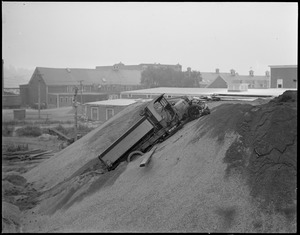 Truck slides down sandbank in Brighton.