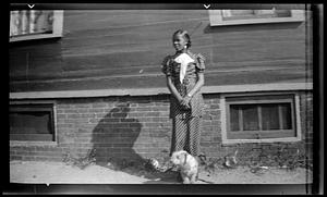 Constance Miller stands with a dog