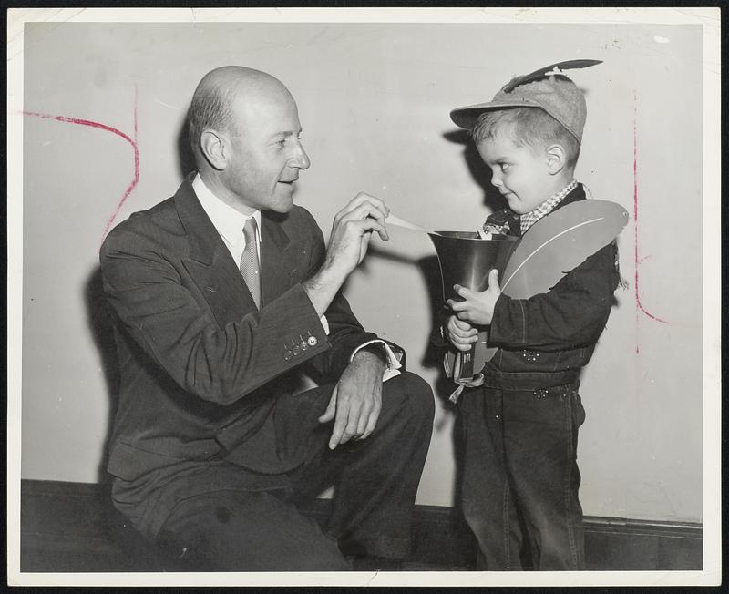 Ringing the Bell with $75,000 combined employe and corporate gift to the Red Feather campaign from Raytheon Manufacturing Co., was Charles F. Adams, Jr., company president. The ringing was figurative, however. The bell was too heavy for Red Feather Boy Stephen Olech, 4, of the West End.