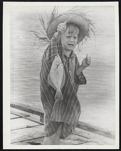 Small Fry is little Melissa Price, 5, who was more surprised than the fish when she hooked it near Wadmalaw Island, S.C. Melissa is crying for her Mom, or Dad, or anybody to come and take it away.