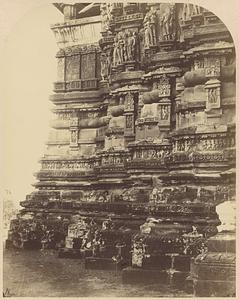 Close view of base of wall showing mouldings and sculptural details, Kandariya Mahadeo Temple, Khajuraho