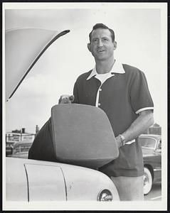 Waived to the Yankees is Ray Scarborough, former Sox pitcher. Ray places bag in trunk of his car at Fenway Park before departing for New York to join new teammates. He was acquired by the Yanks from the Sox for the $10,000 waiver price.