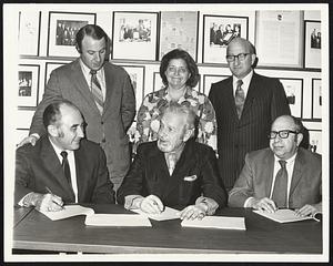 Attending signing of new contract for the international Ladies Garment Workers Union in Boston were, front from left, Howard Abramson, president of New England Sportwear Assn.; Philip Kramer, vice president of the union; Arthur Bloom, president, Boston Apparel Guild; rear from left, Atty. Jay Fialkow; Selma Gottlieb, director of Apparel Industries of New England and Milton Kaplan, assistant of the union. Contract provides workers with cent wage increase and new fringe benefits over