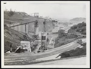 Magnesium for America's War Effort. The Permanente cement plant is pictured in the foreground. Guards photograph all visitors at Permanente.