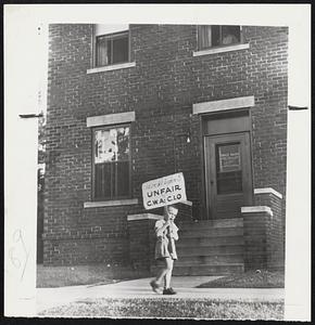 Who's Scared of Cops - Indiana State Police moved into Clinton Monday to reopen the Indiana Bell Telephone exchange, closed after picket line disorders Sunday night, and found only this four-year-old boy on the line. He is Jimmy Virostko, son of Mrs. Meatha Virostko, one of the striking members of the CIO Communication Workers. Eight adult pickets had laid down their signs before the troopers arrived.