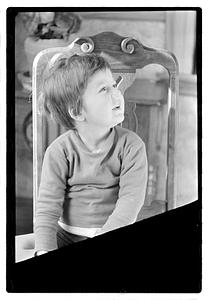 Toddler sitting on a chair