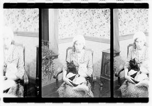 Unidentified woman holding cats