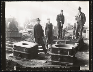 Student officers at work on moulds at foundry