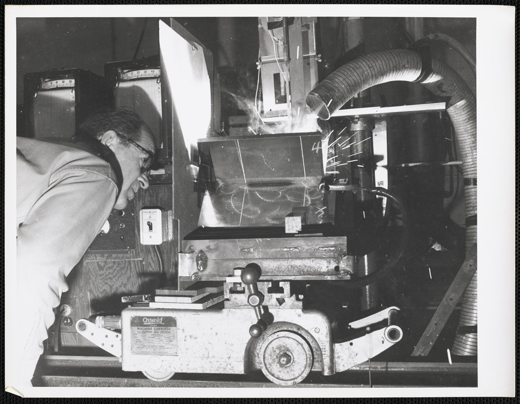 Man with machine carriage for cutting and welding