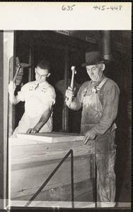 Ordnance workers with tools