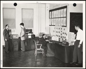 Men exhibiting lab work