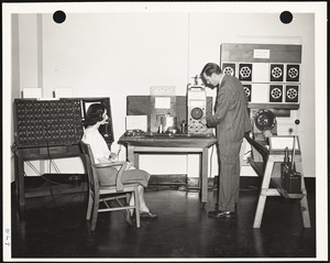 Man and woman testing equipment at exhibition