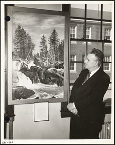 Man with painting of winter scene