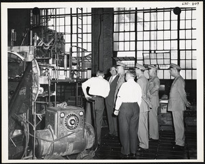 Men inspecting machine