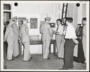 Officers and men observing exhibit