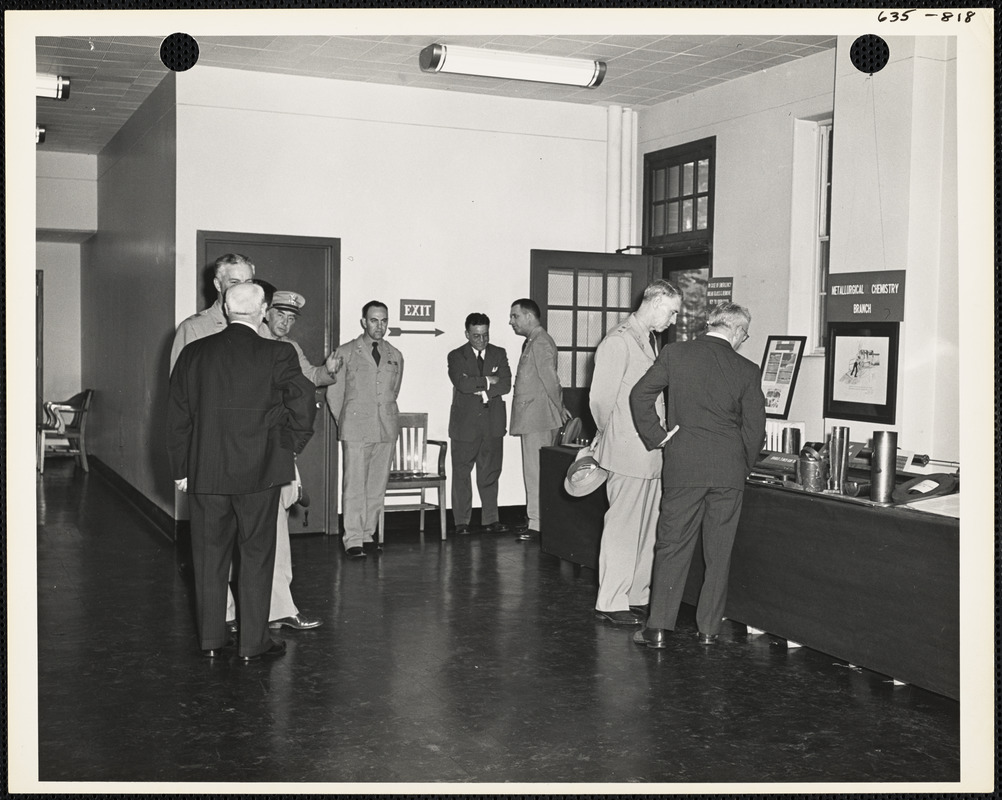 Officers and men observing exhibit