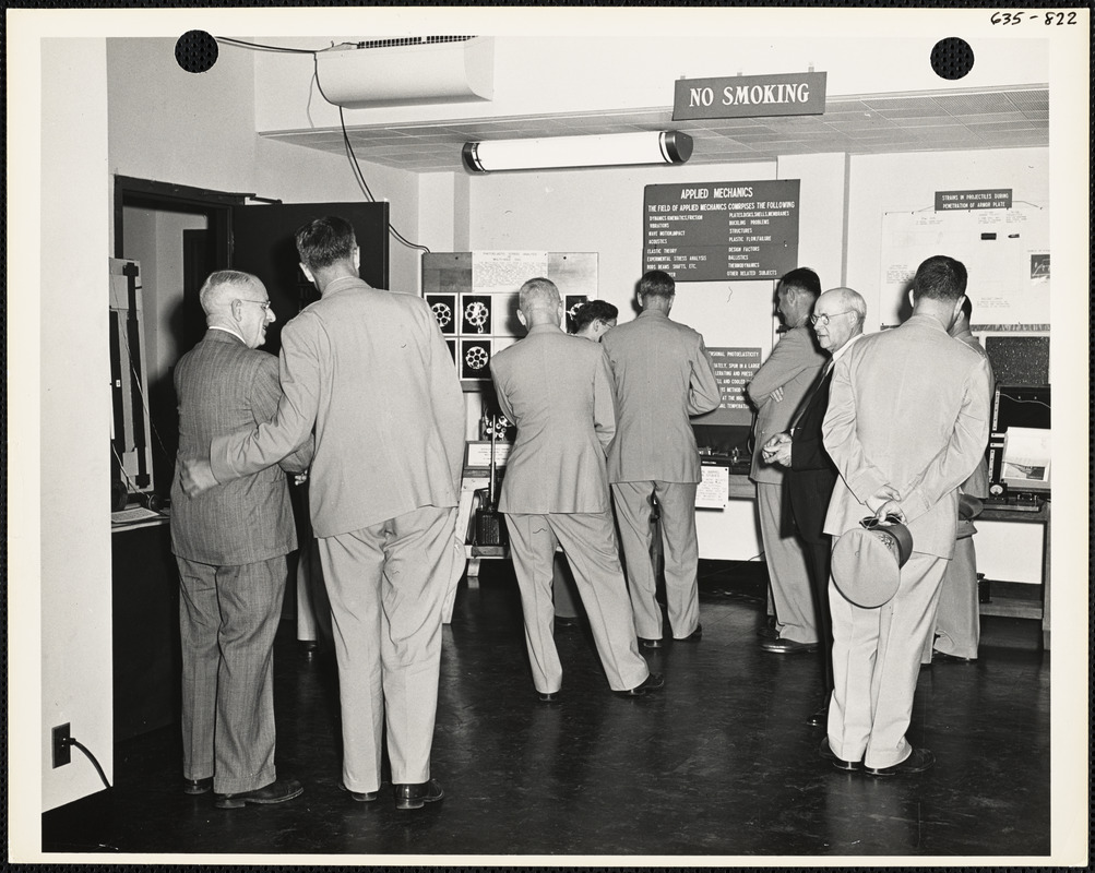 Officers and men observing exhibit