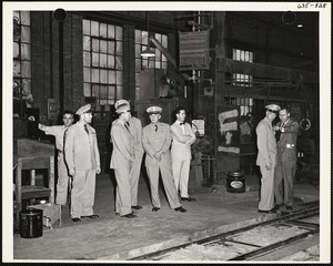 Officers inspecting factory