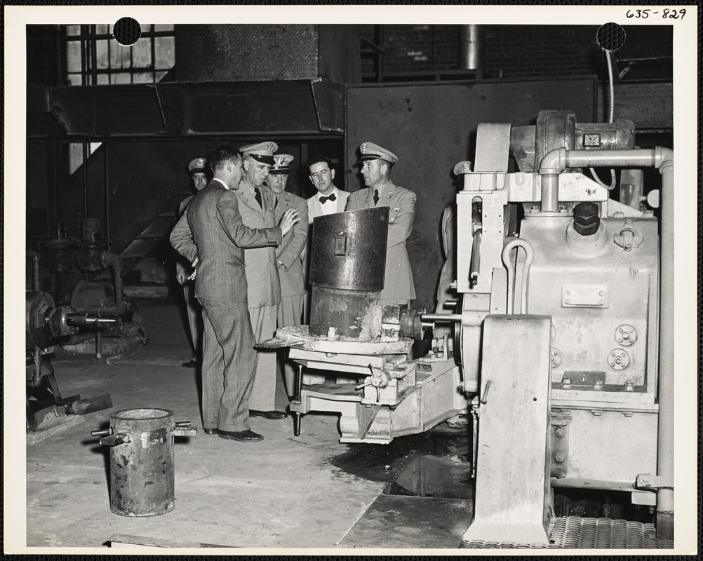 Officers inspecting factory