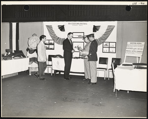 Men and officers with plans at Watertown Arsenal exhibit