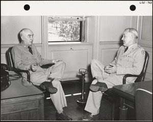 Two officers seated