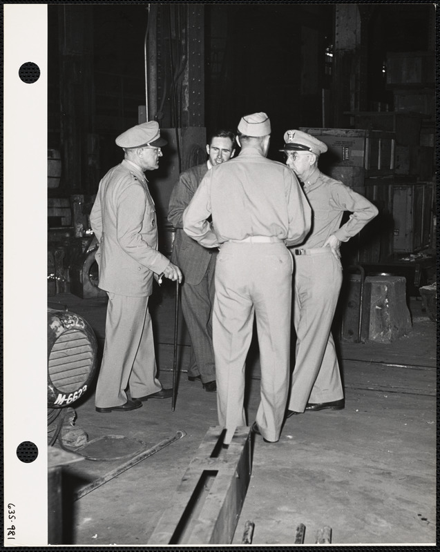 Man and officers in factory