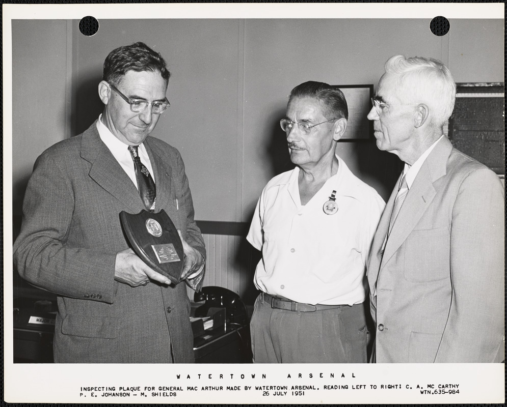 Inspecting plaque for General MacArthur made by Watertown Arsenal