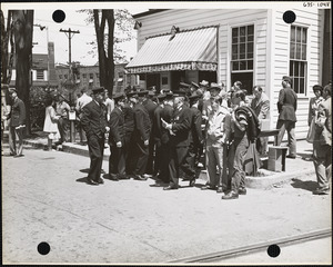 Crowd with men in uniform