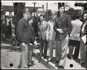 Crowd with men in uniform