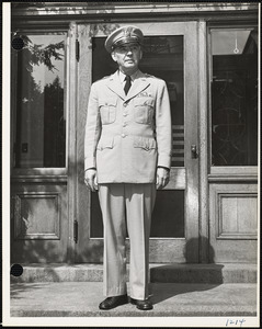 Brig. Gen. Detrick in front of building