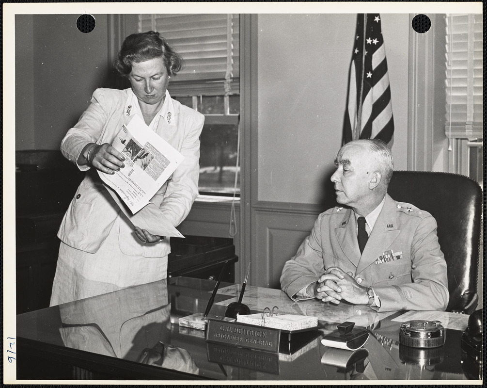 Brig. Gen. Detrick and woman with papers