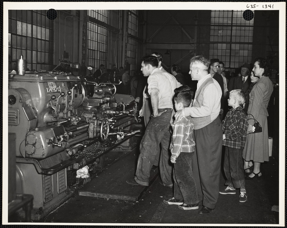 Men observing machines