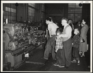 Men observing machines