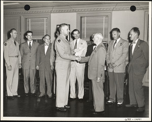 Col. Mesick shaking hands with man