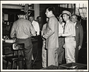 John F. Kennedy in workplace with men