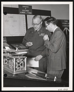 Two men talking near exhibit