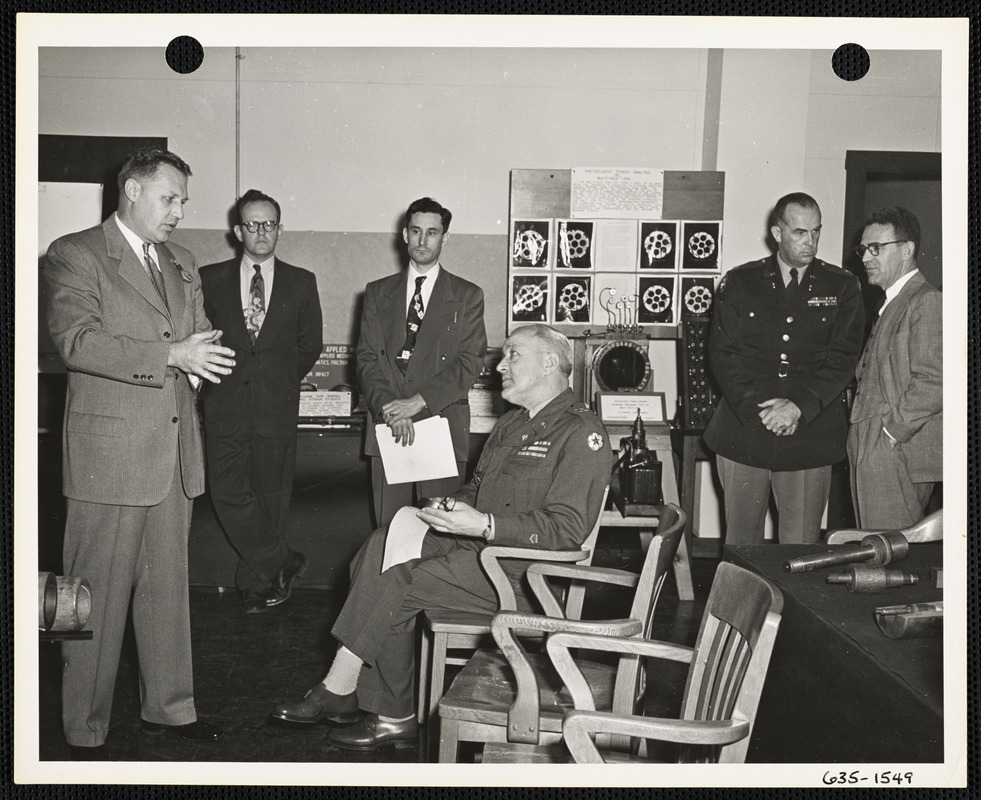 Group of men at exhibit