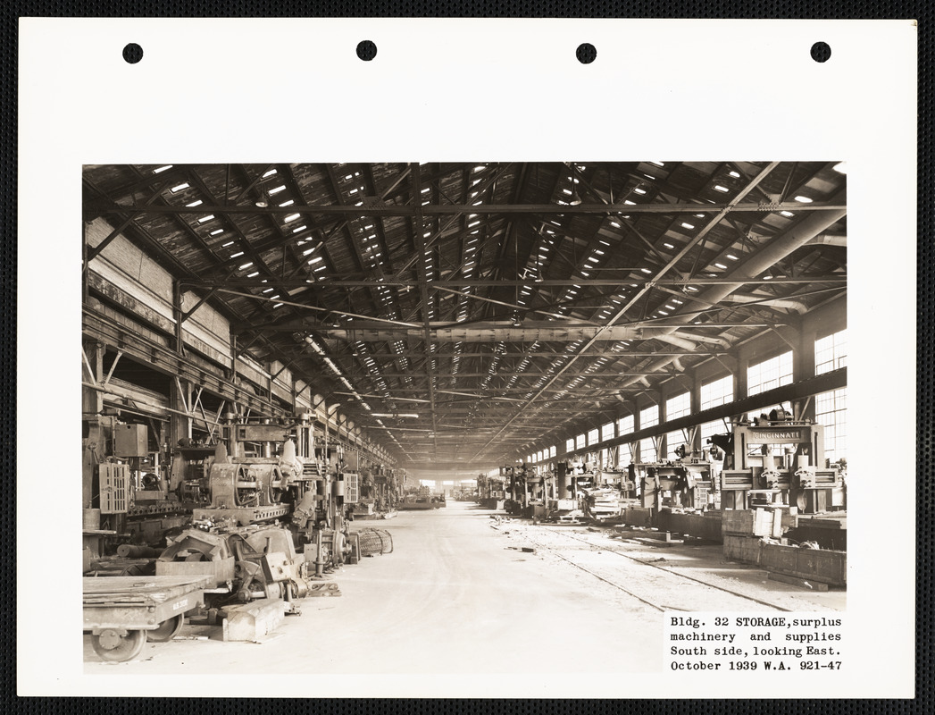 Bldg. 32 storage, surplus machinery and supplies south side, looking east