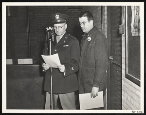 Colonel John Mather, Commanding Officer, Watertown Arsenal, rehearsing script for Army Hour broadcast, 20 February 1944