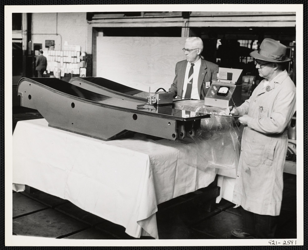 Men inspecting machine