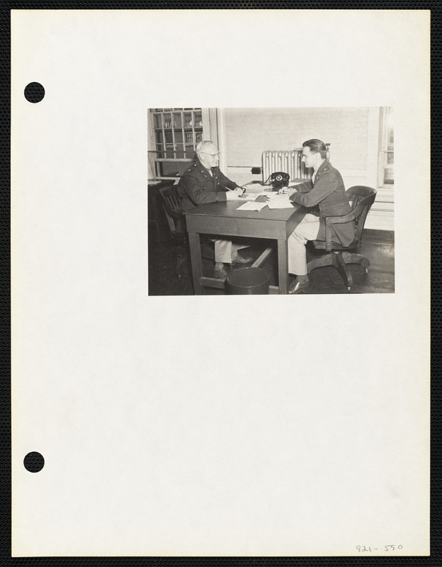 Two military officers at desk