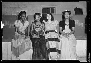 Four women in dresses