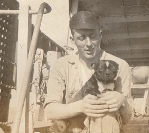 "Water tender" with dog "Jackie" on S.S. Noccalula