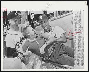 Gang up on Kuenn--Al Kaline (left) veteran Detroit Tigers outfielders and Gail Harris, first baseman, gang up on Tiger outfielder Harvey Kuenn when Kuenn visited the spring training base here today. The three are not due to commence training until Feb. 26 but Harris and Kaline have been working out with the early camp of pitchers and catchers since last Friday. Kuenn signed his new contract yesterday and will begin working out Thursday.