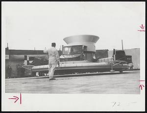 Experimental Hovercraft rises from the ground on a cushion of air in demonstration.