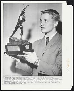 Schollander Receives Sullivan Award--Don Schollander, 18, of Lake Oswego, Ore., the first person to win four gold medals in Olympic Games swimming events, is shown with the James E. Sullivan award after he received it in New York today. The award was made at the New York Athletic Club to the "nation's outstanding amateur athlete."